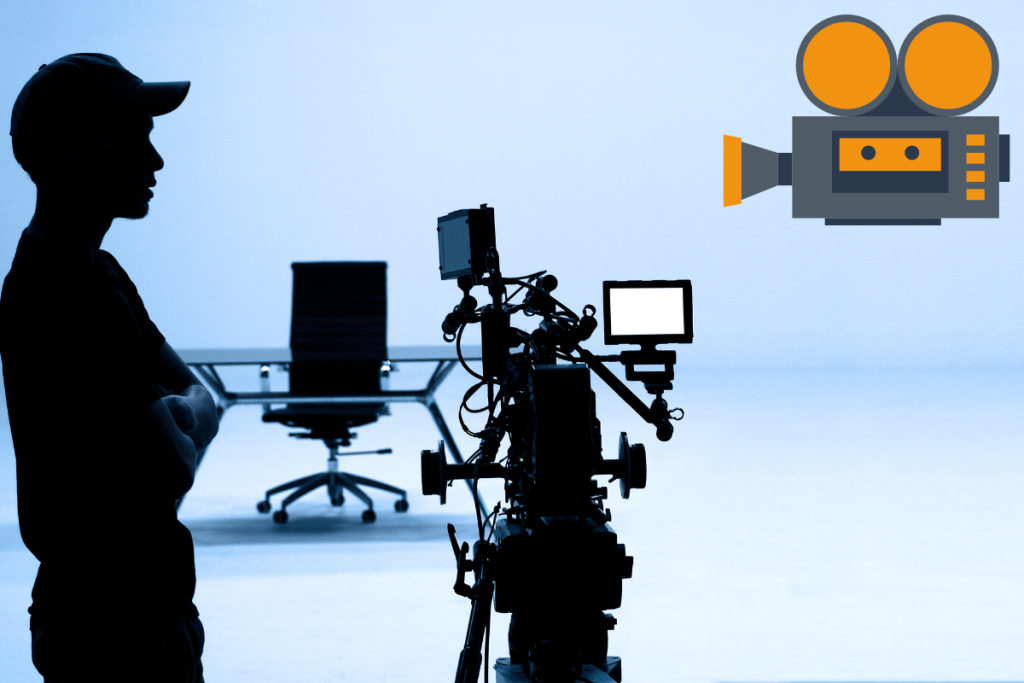 A camera man standing during the production phase of video production.